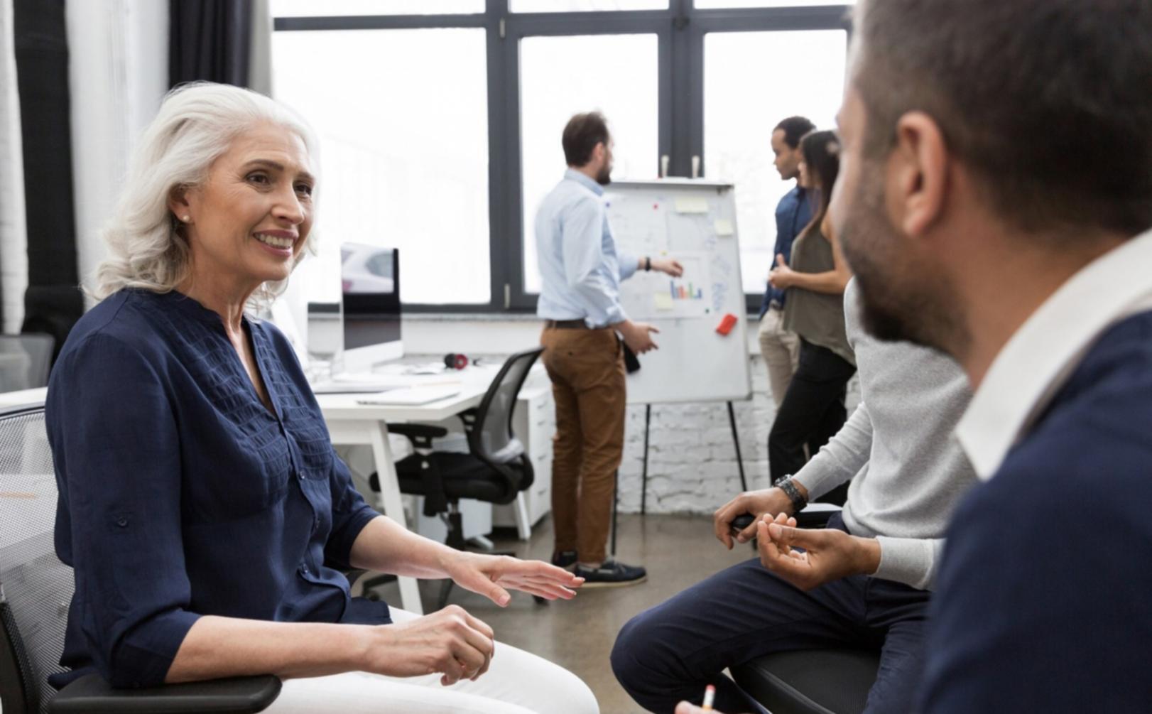 Family reviewing investment documents together at dining table